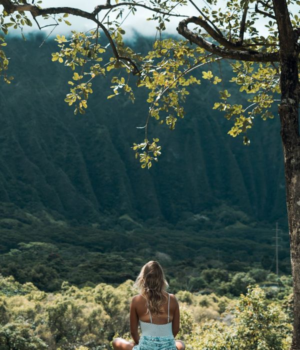 Woman in a calm yoga pose, embodying peace and balance.